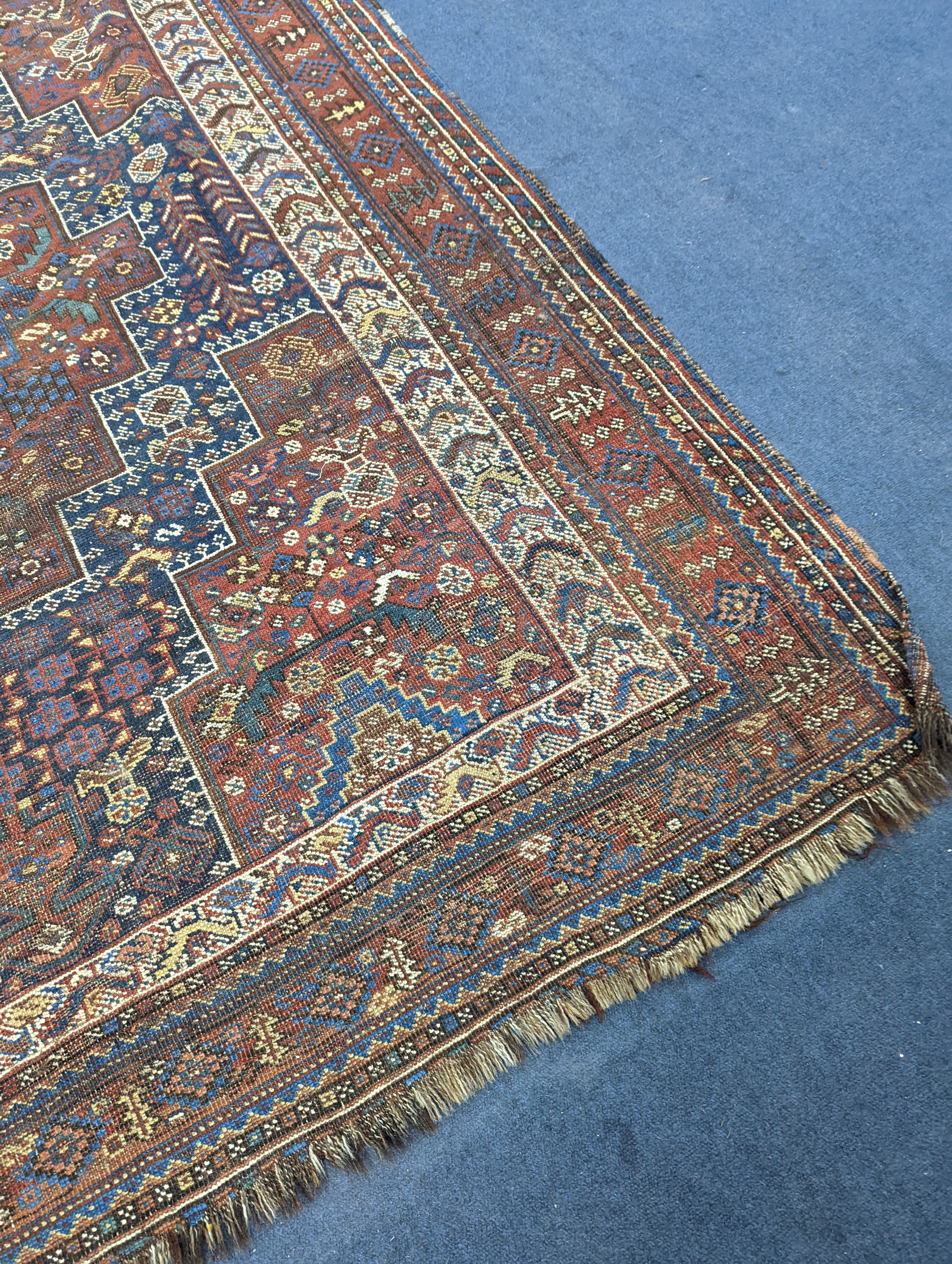 A Caucasian red ground rug and a Belouch rug, larger 200 x 165cm